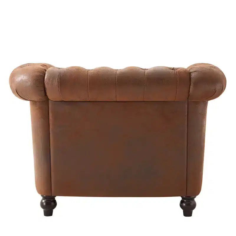 Fauteuil club Chesterfield moderne avec accoudoirs arrondis et clous décoratifs