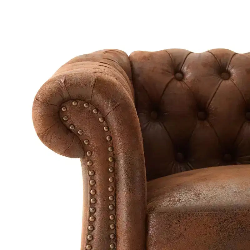 Fauteuil club Chesterfield moderne avec accoudoirs arrondis et clous décoratifs