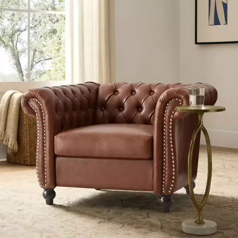 Fauteuil club Chesterfield moderne avec accoudoirs arrondis et clous décoratifs