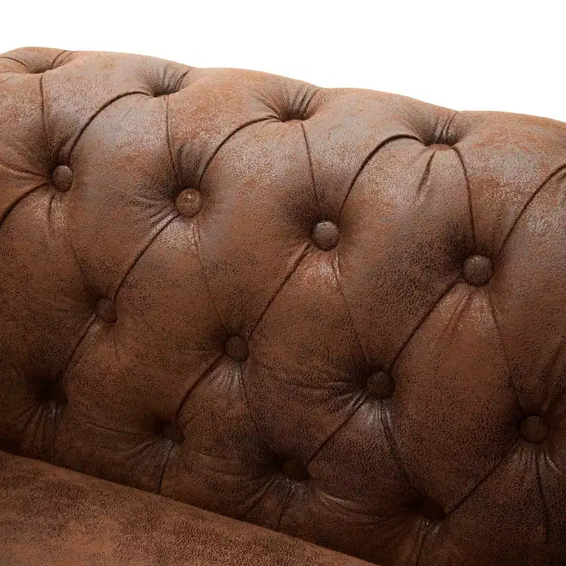 Fauteuil club Chesterfield moderne avec accoudoirs arrondis et clous décoratifs