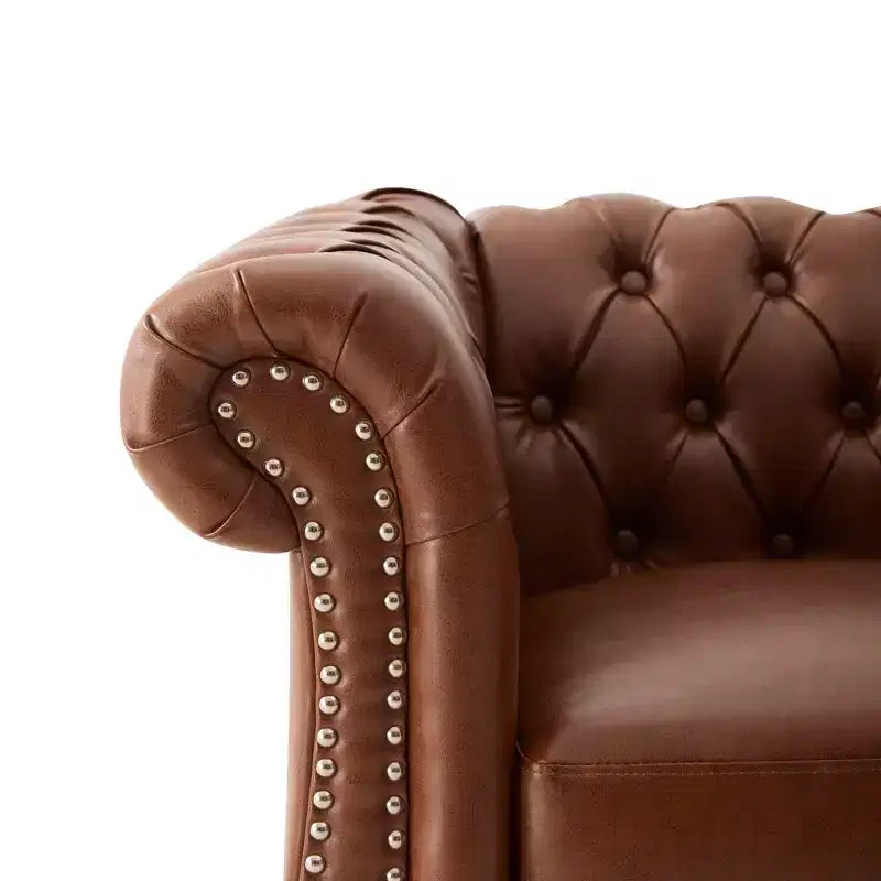Fauteuil club Chesterfield moderne avec accoudoirs arrondis et clous décoratifs