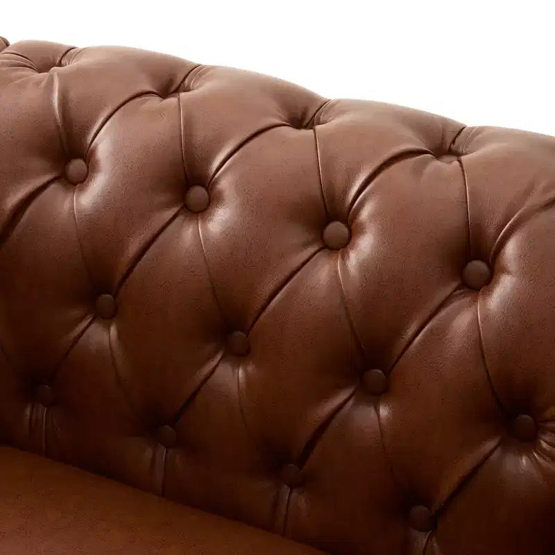 Fauteuil club Chesterfield moderne avec accoudoirs arrondis et clous décoratifs