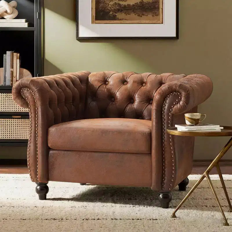 Fauteuil club Chesterfield moderne avec accoudoirs arrondis et clous décoratifs